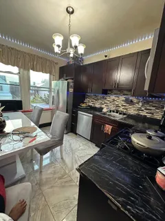 a bed sitting in a room next to a window