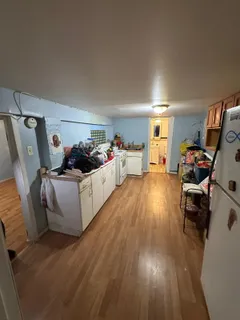 a bathroom with a sink toilet mirror vanity and bathtub