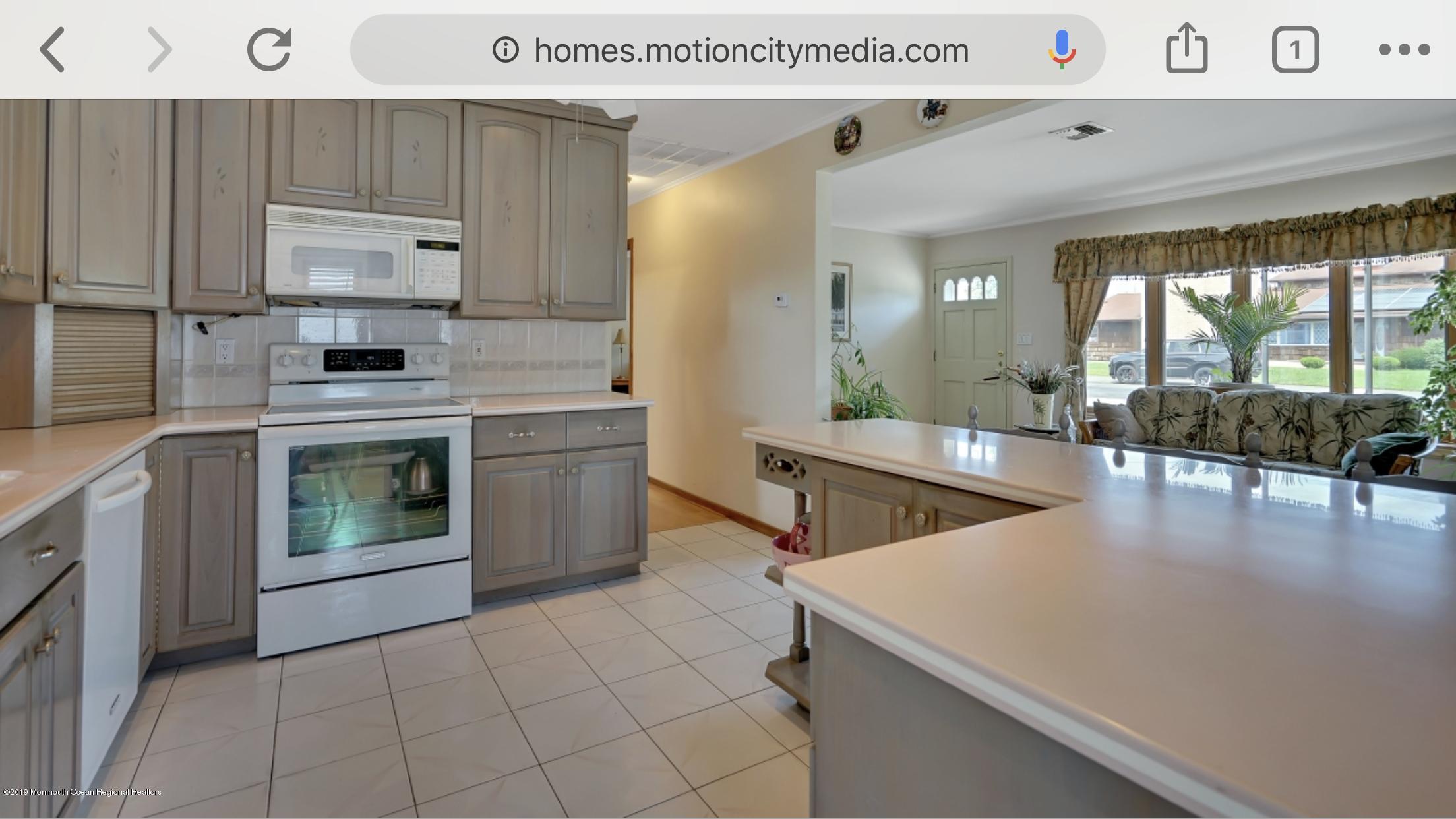 40 Cedar Run Road Bayville, NJ 08721 - Photo 3 of 12 a kitchen with a stove a refrigerator and a stove