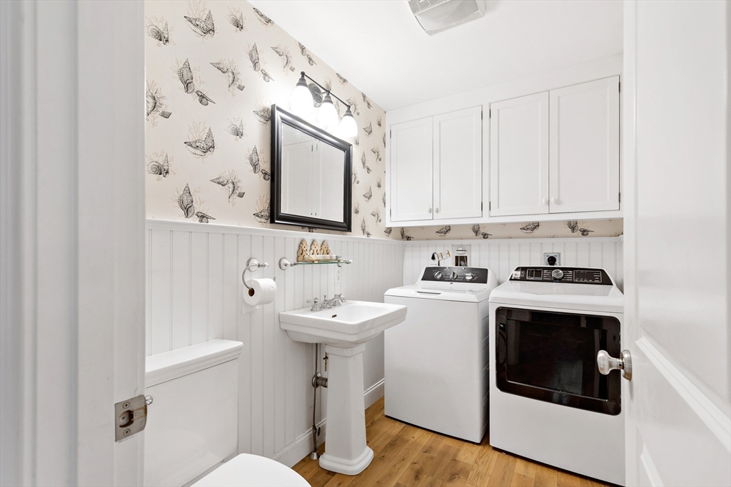 50 Pheasant Way Barnstable, MA 02632 - Photo 13 of 37 a view of a sink and dishwasher with wooden floor
