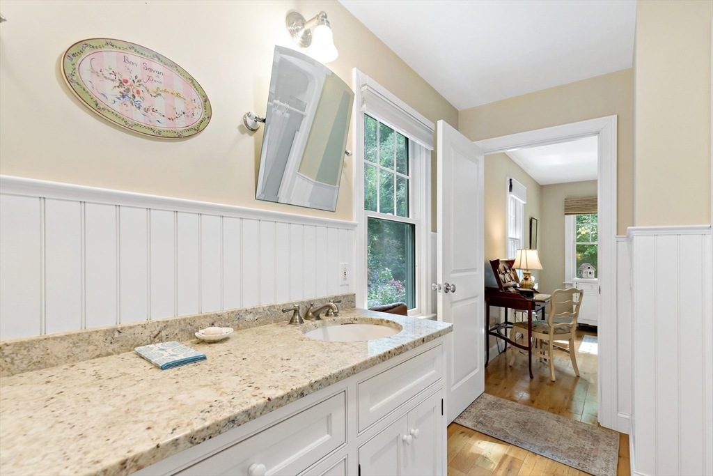 50 Pheasant Way Barnstable, MA 02632 - Photo 15 of 37 a bathroom with a granite countertop sink and a mirror