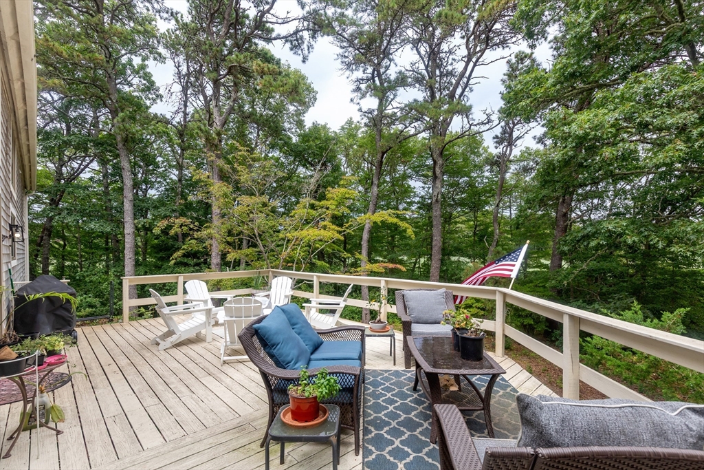 50 Pheasant Way Barnstable, MA 02632 - Photo 25 of 37 a view of deck with furniture and trees around