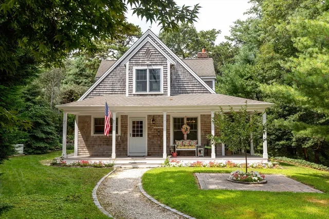 a aerial view of a house with a yard patio and swimming pool