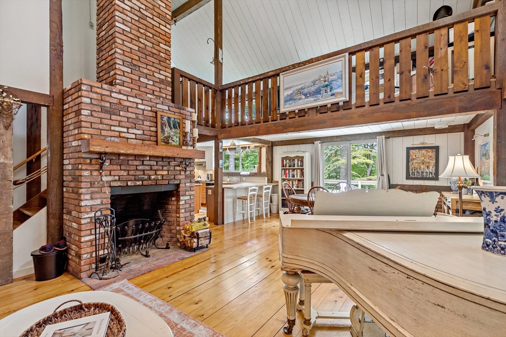 50 Pheasant Way Barnstable, MA 02632 - Photo 31 of 37 a living room with furniture a fireplace and a large window