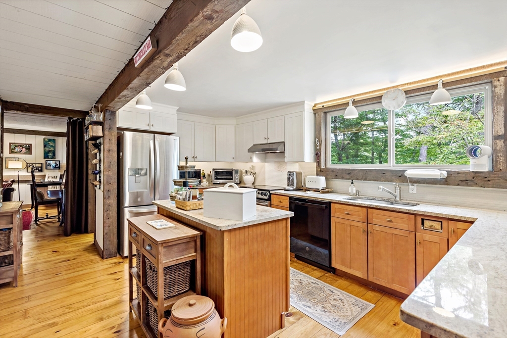 50 Pheasant Way Barnstable, MA 02632 - Photo 32 of 37 a kitchen with a sink a counter top stainless steel appliances and cabinets