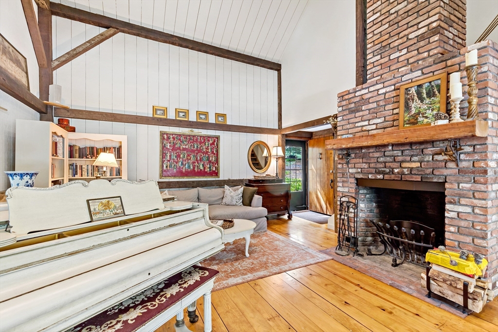 50 Pheasant Way Barnstable, MA 02632 - Photo 35 of 37 a living room with furniture and a fireplace
