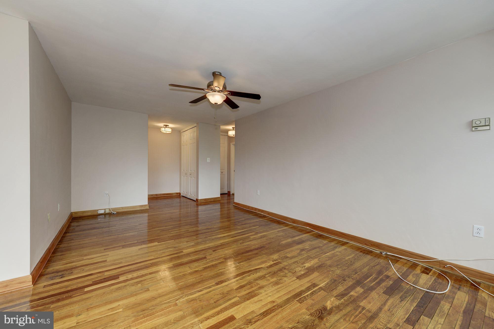 1300 South Arlington Ridge Road, Unit 508 Arlington, VA 22202 - Photo 14 of 24 a view of an empty room with wooden floor