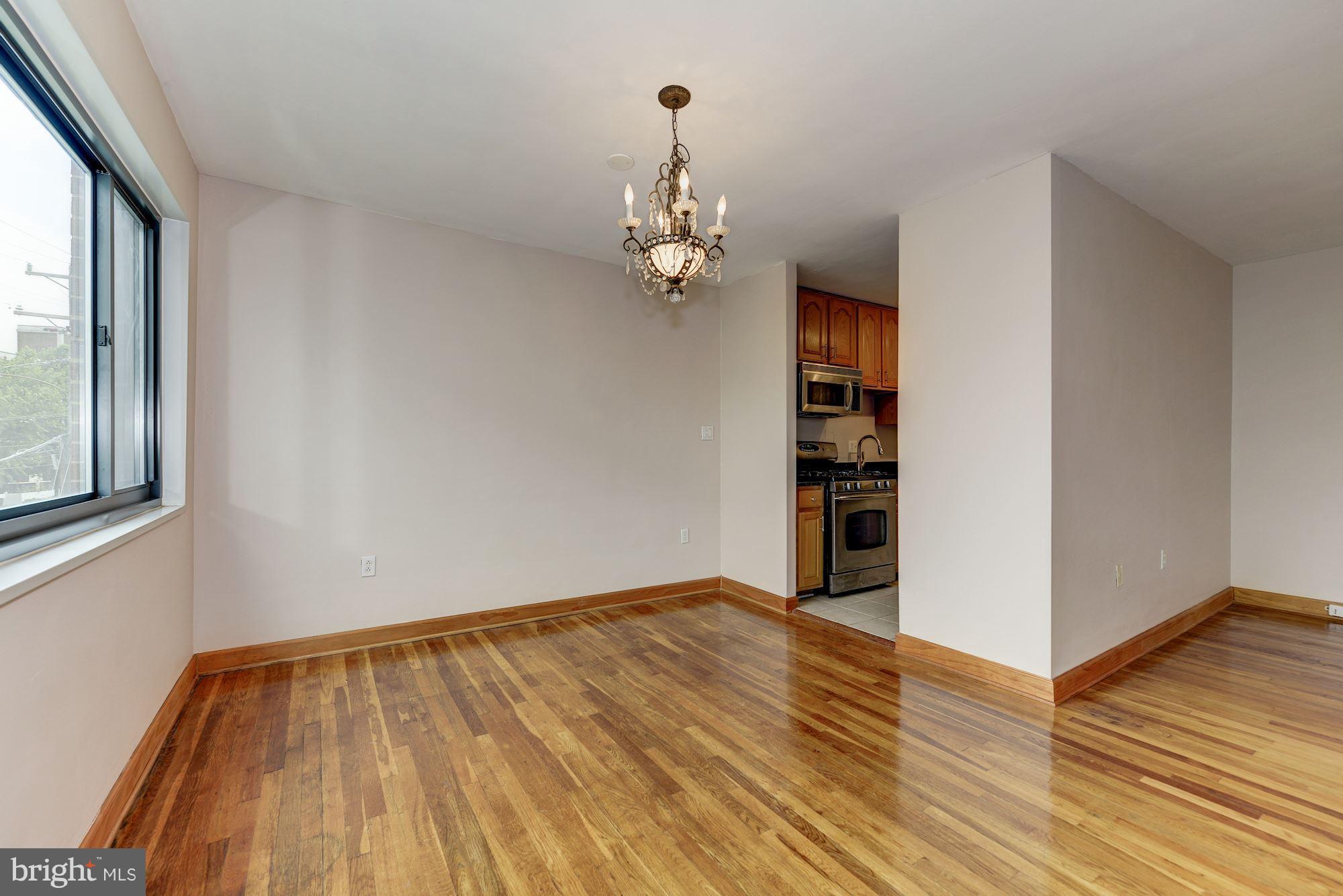 1300 South Arlington Ridge Road, Unit 508 Arlington, VA 22202 - Photo 17 of 24 wooden floor in an empty room with a window