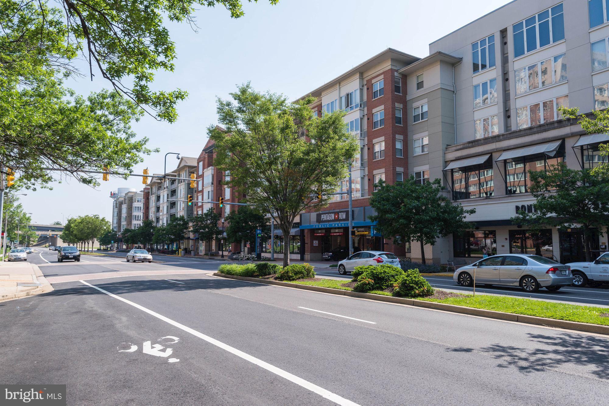 1300 South Arlington Ridge Road, Unit 508 Arlington, VA 22202 - Photo 23 of 24 a front view of a building with street and trees