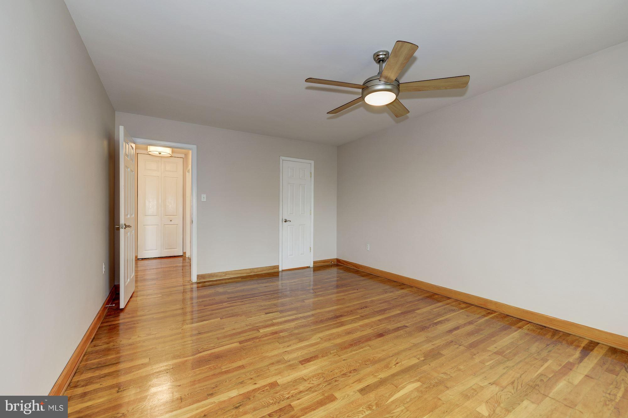1300 South Arlington Ridge Road, Unit 508 Arlington, VA 22202 - Photo 10 of 24 a view of empty room with wooden floor