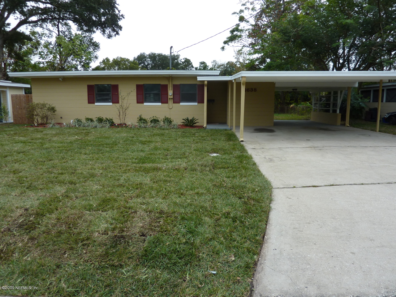 1638 Morgana Road Jacksonville, FL 32211 - Photo 1 of 8 a view of house with backyard outdoor seating area and green space
