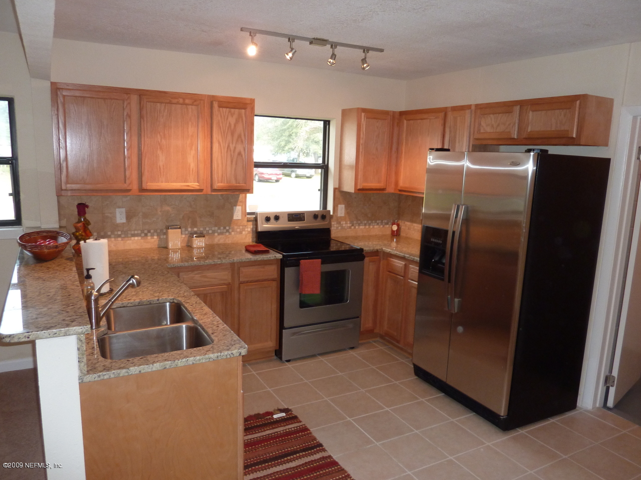 1638 Morgana Road Jacksonville, FL 32211 - Photo 2 of 8 a kitchen that has a sink cabinets counter space and stainless steel appliances