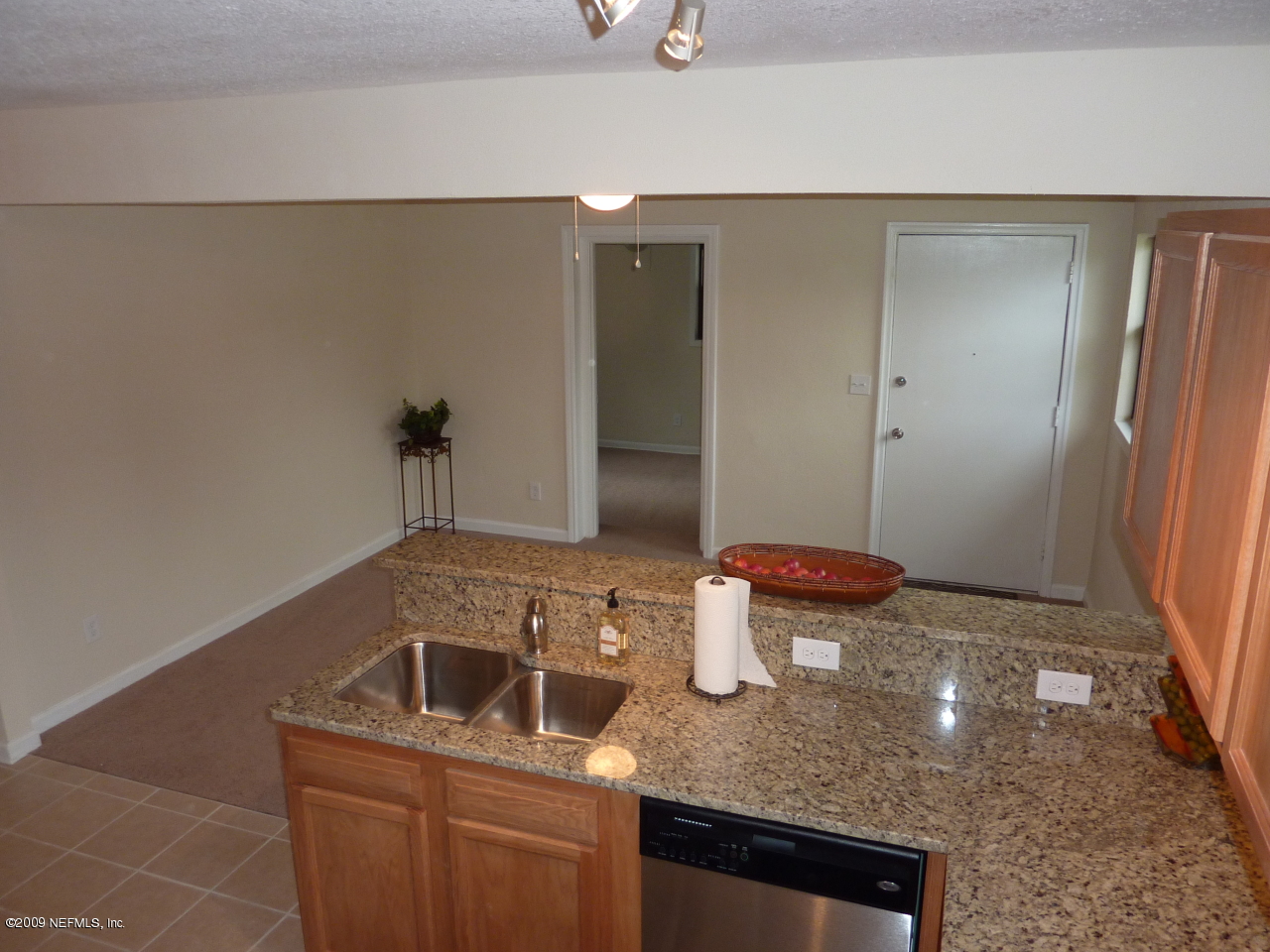 1638 Morgana Road Jacksonville, FL 32211 - Photo 3 of 8 a bathroom with a granite countertop sink and a mirror