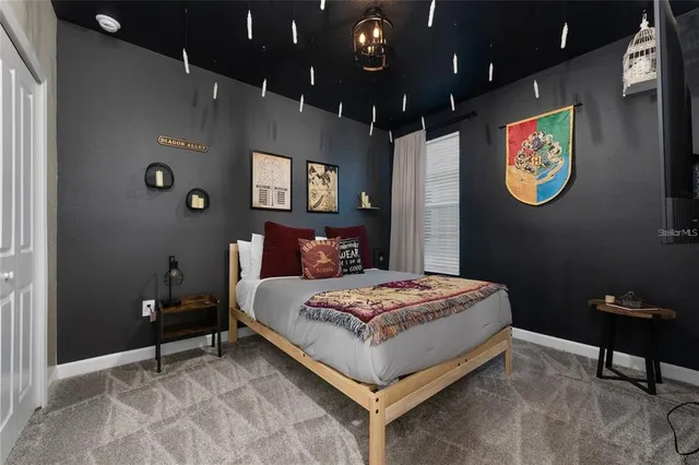 a bedroom with a bed and a chair