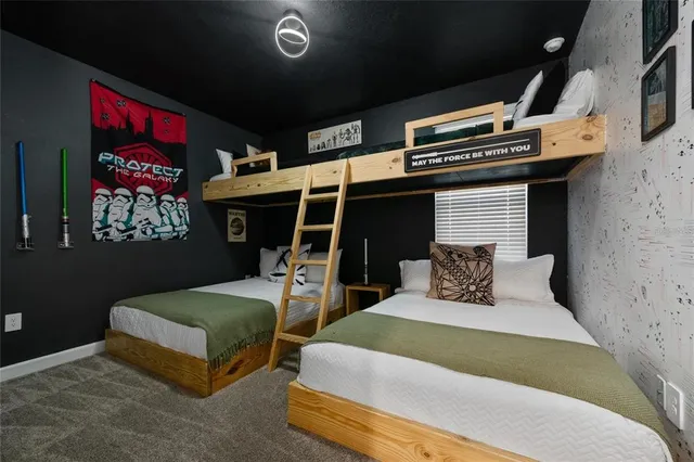 a bedroom with bed and a window