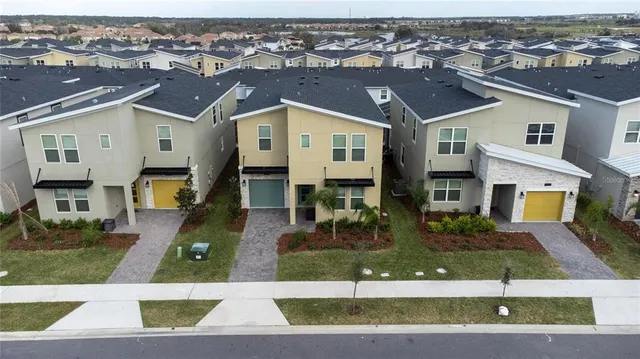 an aerial view of a house with street view