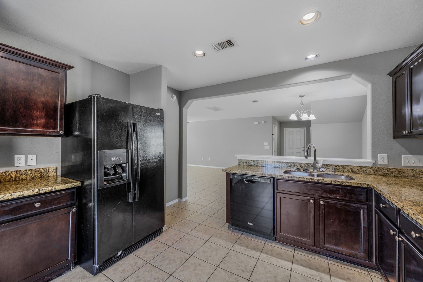 21310 Bandera Ranch Lane Katy, TX 77449 - Photo 12 of 39 a kitchen with stainless steel appliances granite countertop a stove a refrigerator and a sink