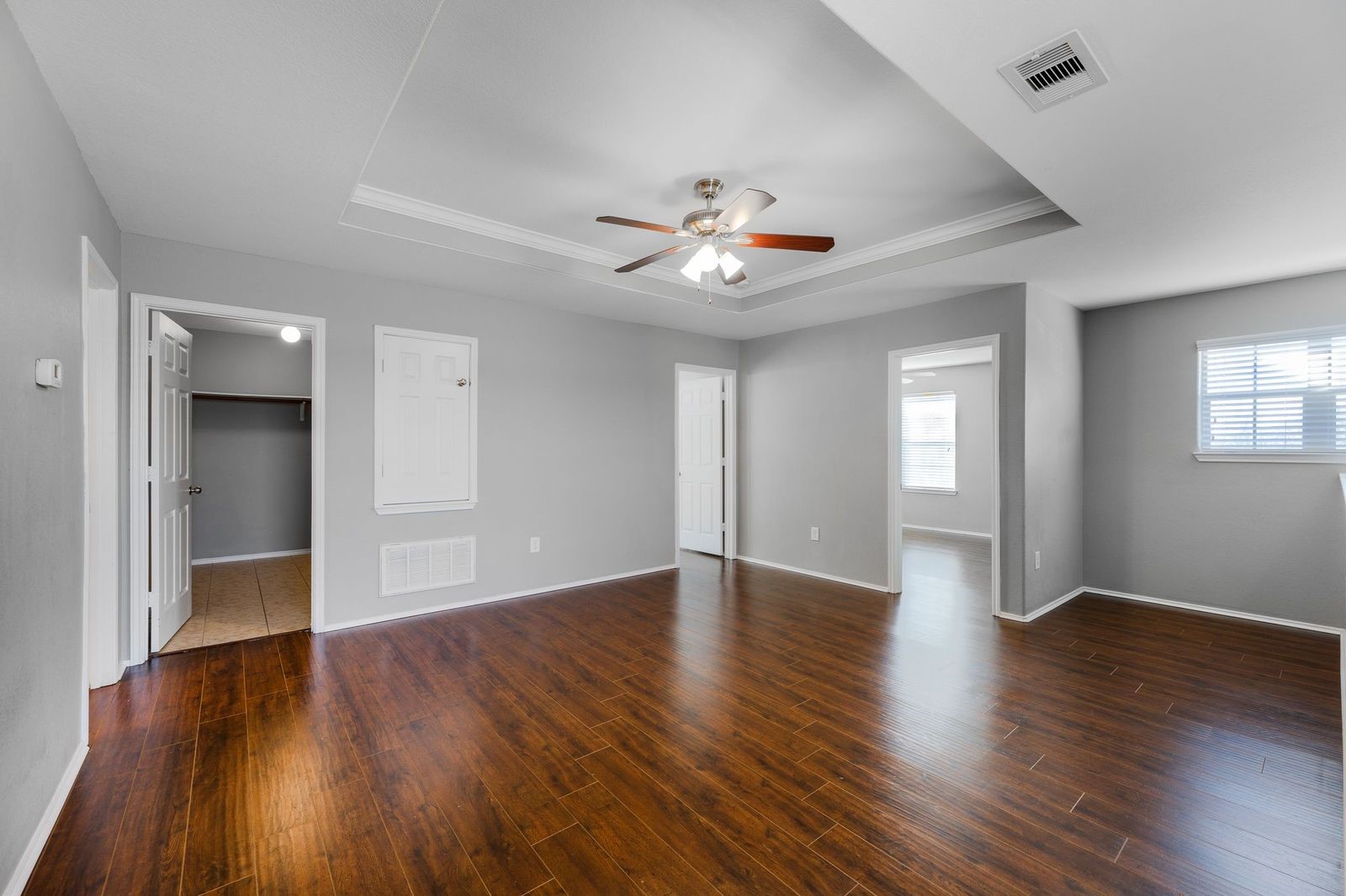 21310 Bandera Ranch Lane Katy, TX 77449 - Photo 17 of 39 a view of an empty room with a window and wooden floor