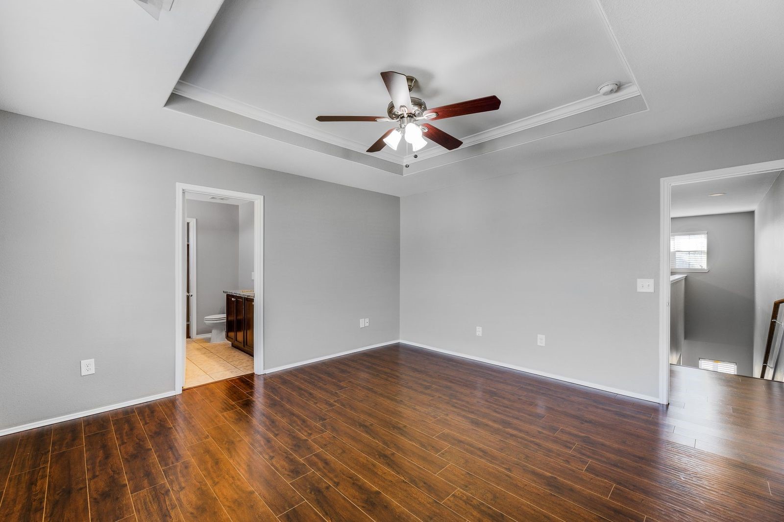 21310 Bandera Ranch Lane Katy, TX 77449 - Photo 18 of 39 wooden floor in an empty room with a window