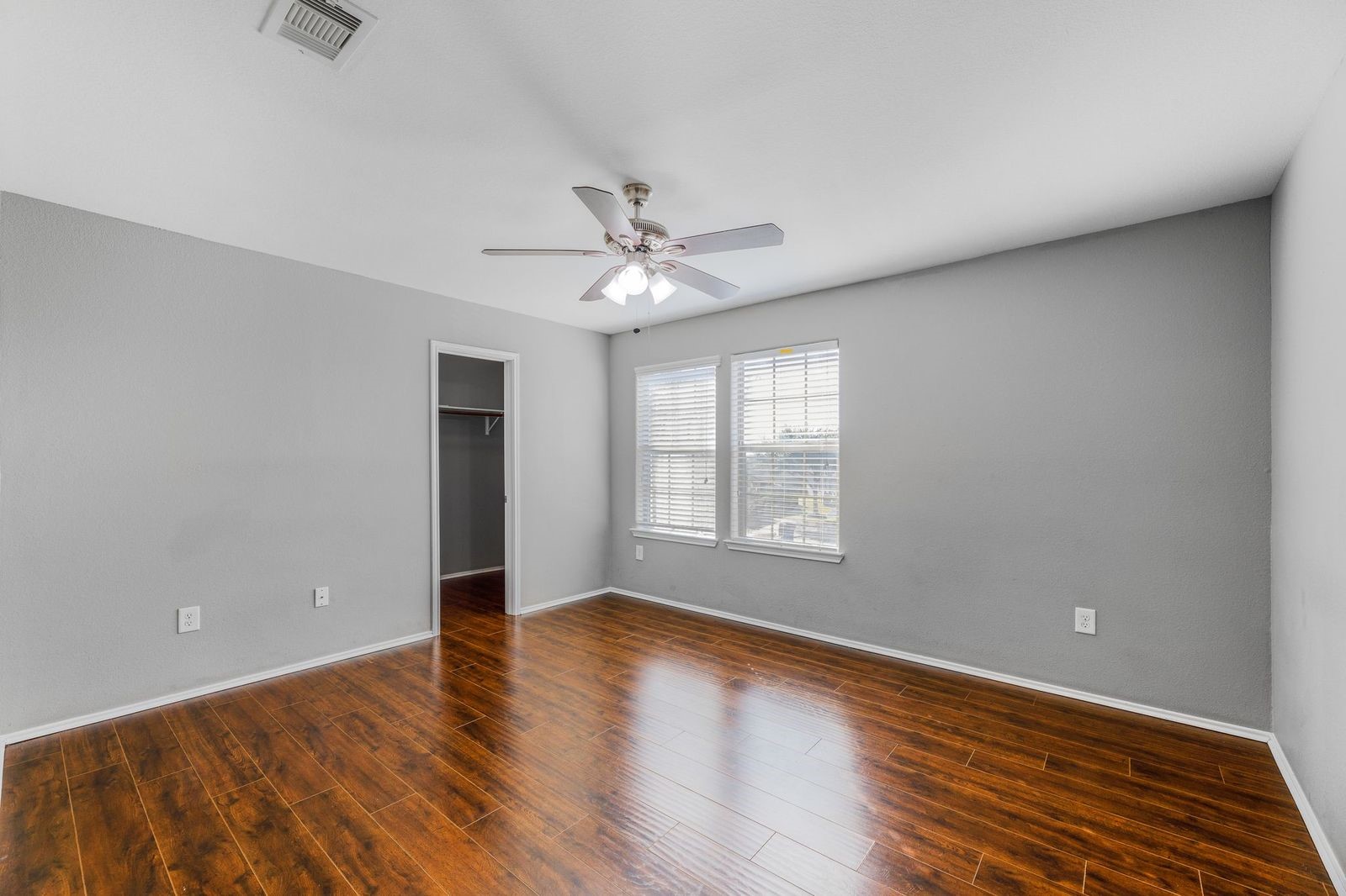 21310 Bandera Ranch Lane Katy, TX 77449 - Photo 19 of 39 wooden floor in an empty room with a window