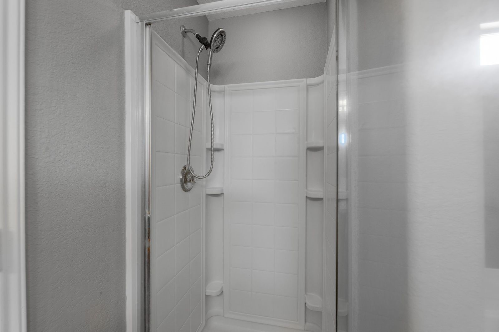 21310 Bandera Ranch Lane Katy, TX 77449 - Photo 23 of 39 a bathroom with a glass shower door
