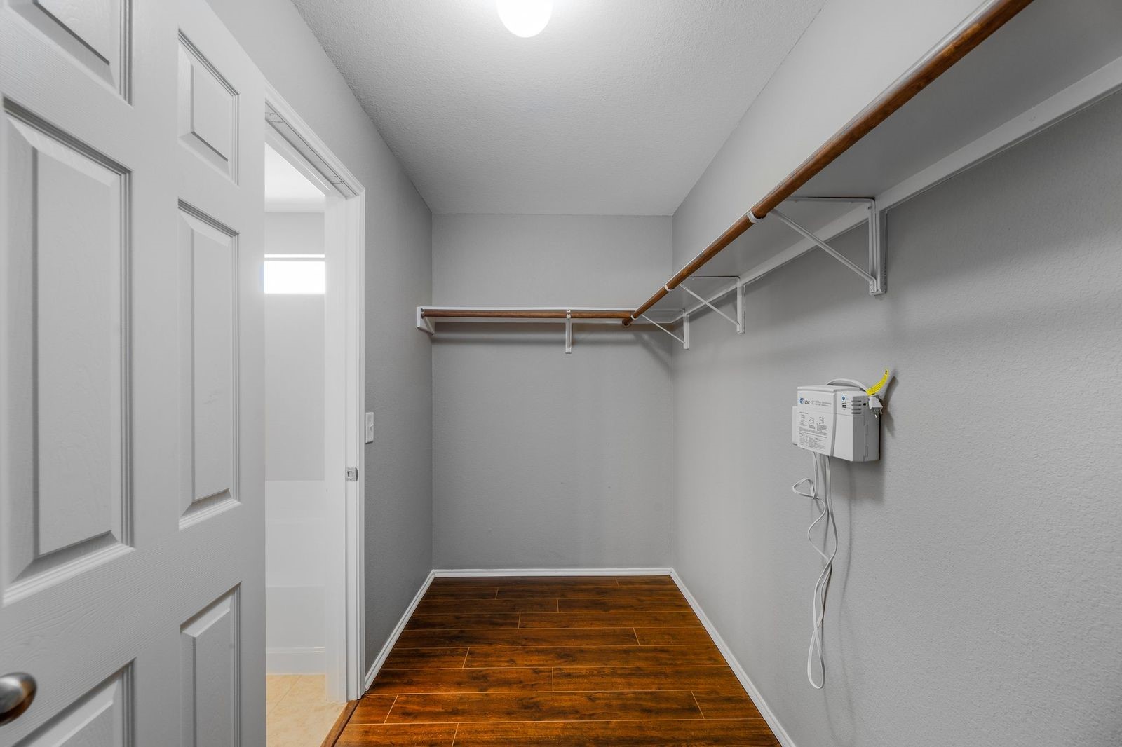 21310 Bandera Ranch Lane Katy, TX 77449 - Photo 24 of 39 a view of a hallway with wooden floor and staircase