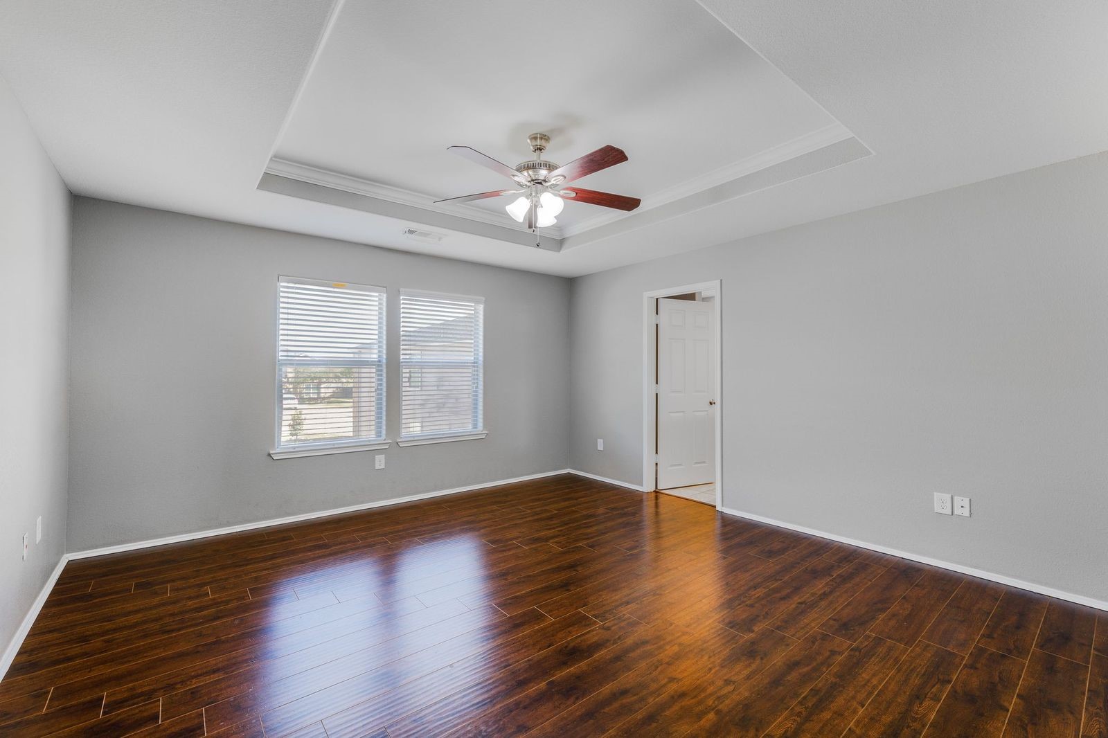 21310 Bandera Ranch Lane Katy, TX 77449 - Photo 25 of 39 a view of an empty room with wooden floor and a window