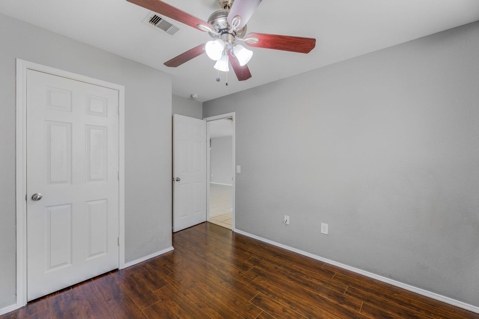 21310 Bandera Ranch Lane Katy, TX 77449 - Photo 30 of 39 a view of an empty room with wooden floor