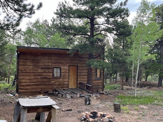 7 Tc Road Dumont, CO 80436 - Photo 6 of 9 a front view of a house with a tree