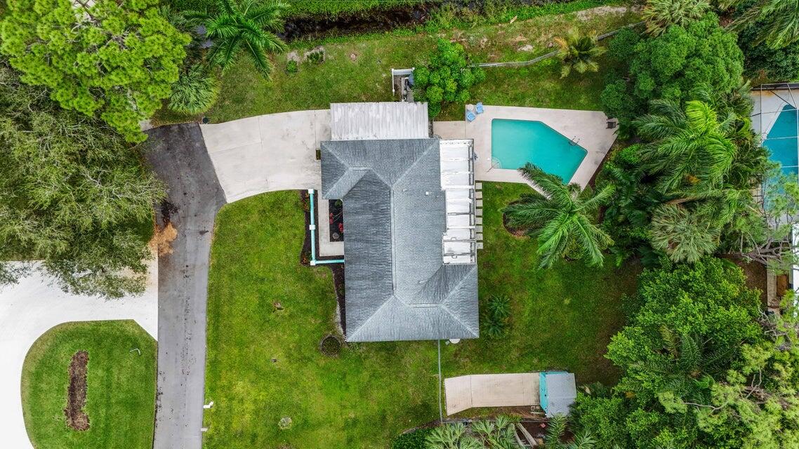 5554 Hibiscus Road Jupiter, FL 33458 - Photo 43 of 70 an aerial view of a house