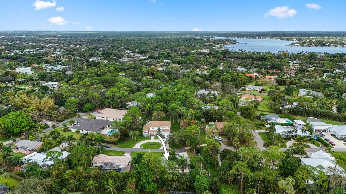 5554 Hibiscus Road Jupiter, FL 33458 - Photo 47 of 70 an aerial view of residential houses with outdoor space and trees