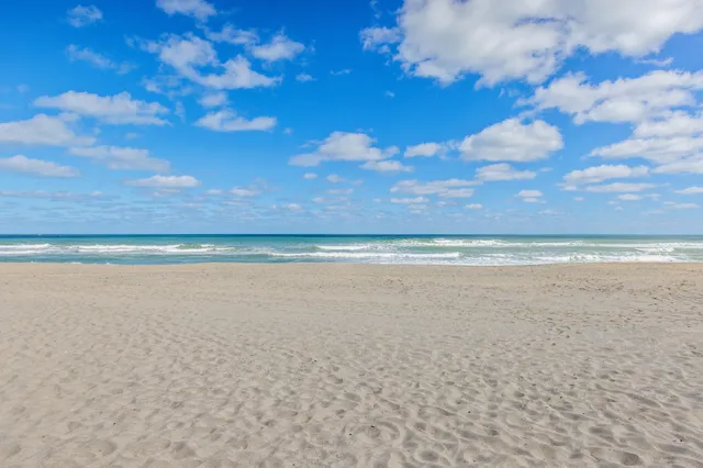 a view of swimming pool with a table and chairs