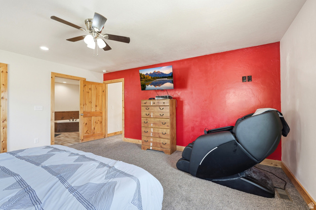 306 Spring Road Preston, ID 83263 - Photo 16 of 55 Spacious room featuring a textured red accent wall and light-colored walls