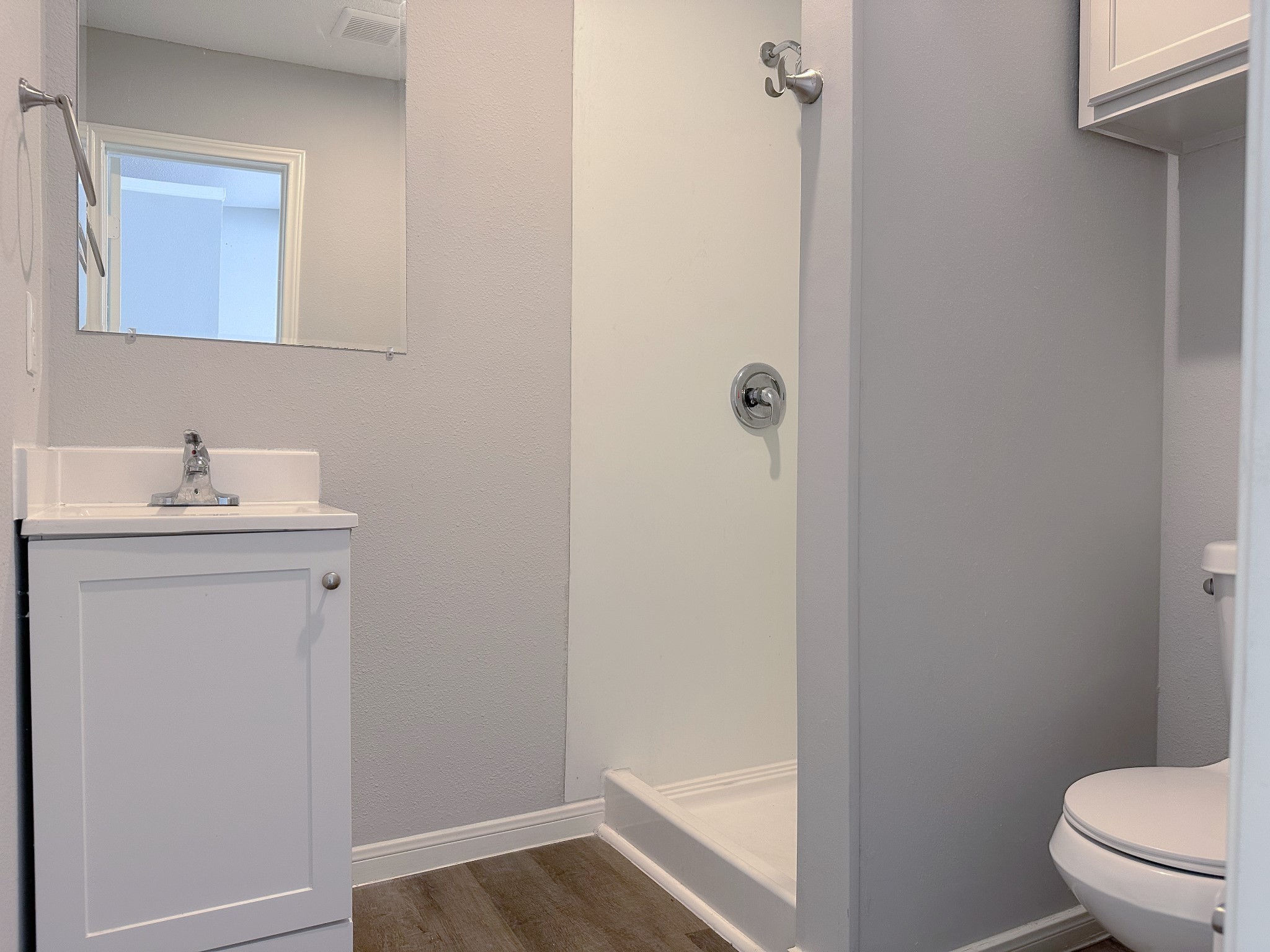2704 Brewster Street Houston, TX 77026 - Photo 5 of 10 a bathroom with a sink toilet and vanity