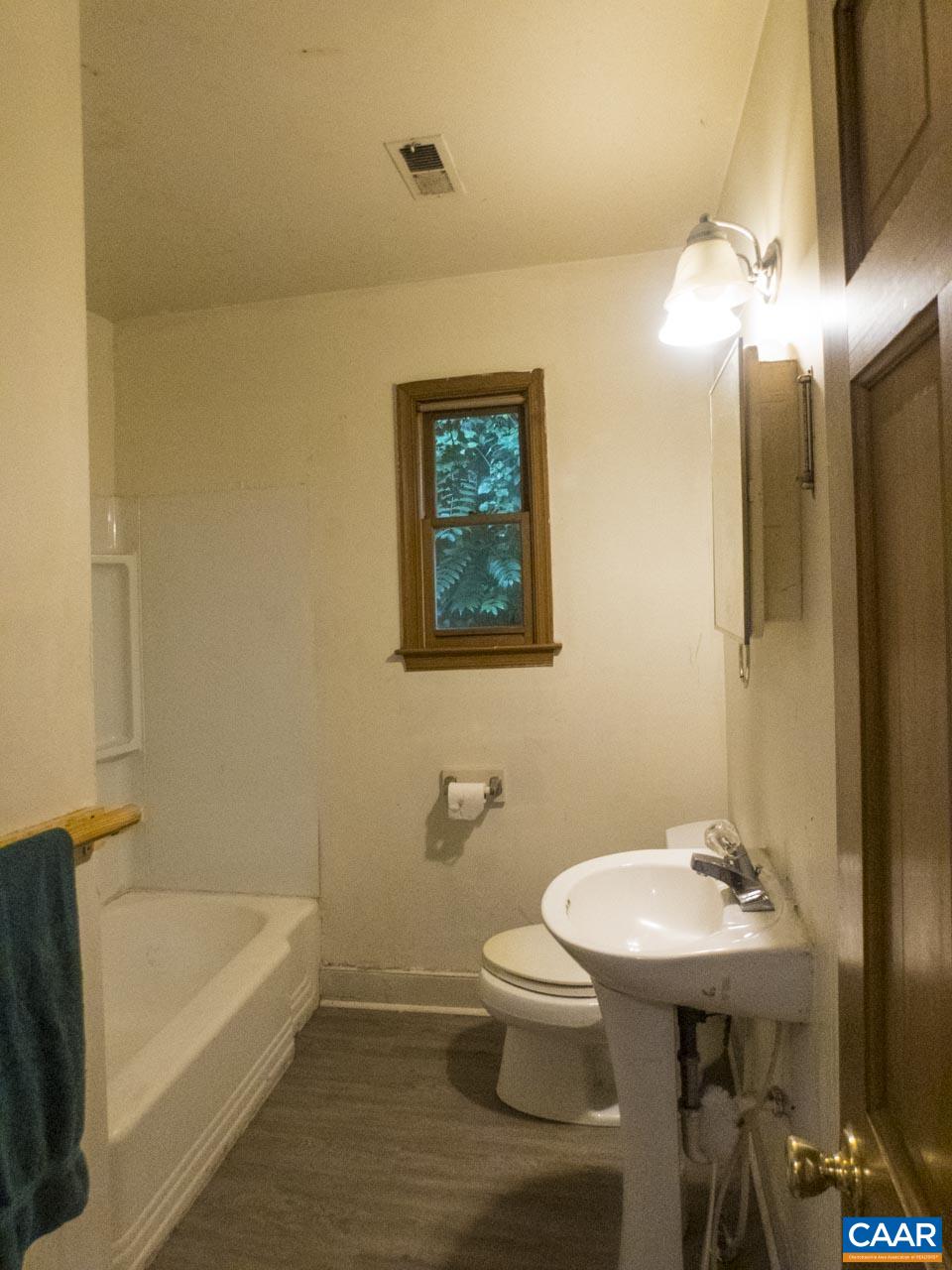 309 Valley Rd Extension Charlottesville, VA 22903 - Photo 12 of 23 a bathroom with a sink a toilet and bathtub