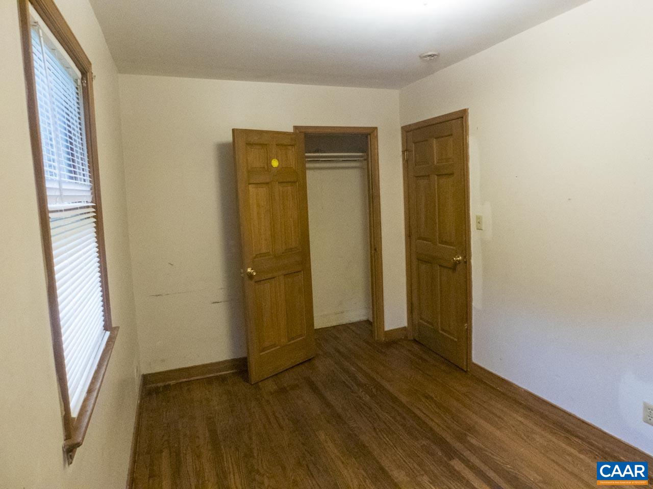 309 Valley Rd Extension Charlottesville, VA 22903 - Photo 13 of 23 an empty room with wooden floor and a window
