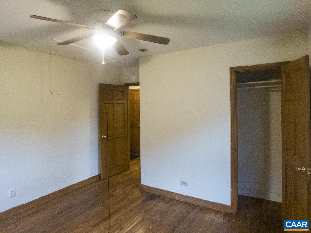 309 Valley Rd Extension Charlottesville, VA 22903 - Photo 15 of 23 an empty room with wooden floor and closet area