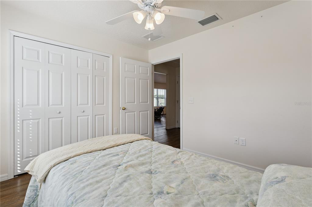 112 Turtle Run Umatilla, FL 32784 - Photo 14 of 32 a bedroom with a bed and a chandelier