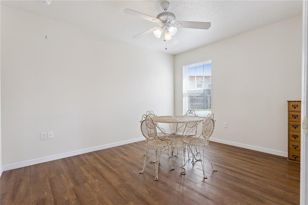 112 Turtle Run Umatilla, FL 32784 - Photo 16 of 32 a view of a room with wooden floor and windows