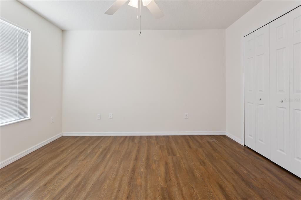 112 Turtle Run Umatilla, FL 32784 - Photo 18 of 32 a view of room with wooden floor and white walls