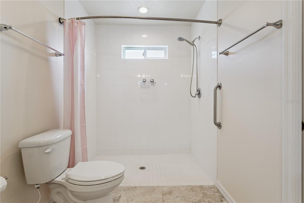 112 Turtle Run Umatilla, FL 32784 - Photo 20 of 32 a bathroom with a shower and a toilet