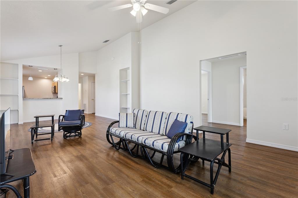 112 Turtle Run Umatilla, FL 32784 - Photo 2 of 32 a living room with furniture and wooden floor