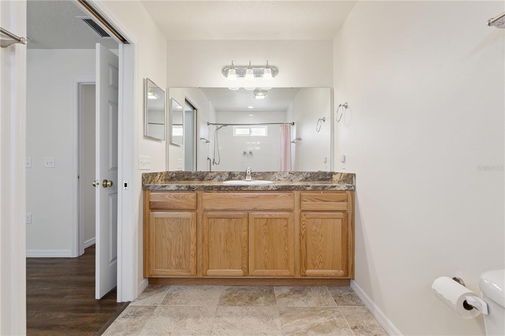 112 Turtle Run Umatilla, FL 32784 - Photo 21 of 32 a bathroom with a sink and a mirror