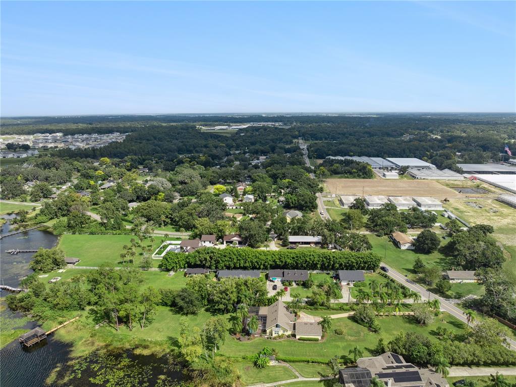 112 Turtle Run Umatilla, FL 32784 - Photo 30 of 32 an aerial view of a residential houses with outdoor space and trees
