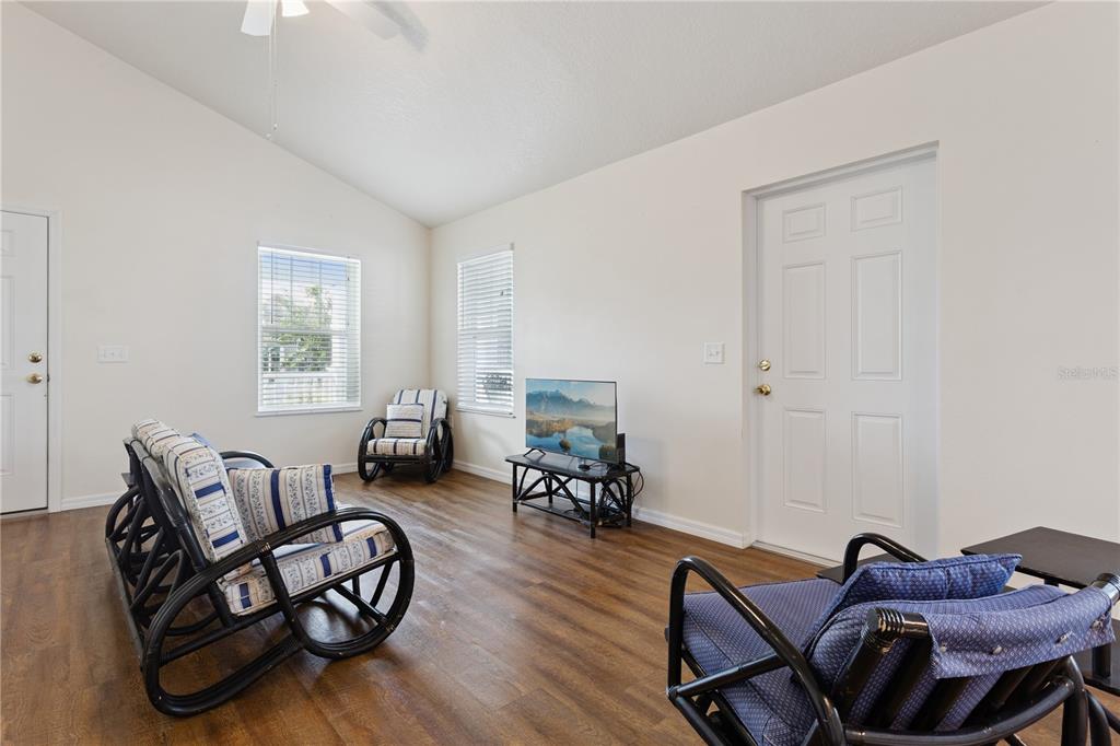 112 Turtle Run Umatilla, FL 32784 - Photo 7 of 32 a living room with furniture and a wooden floor