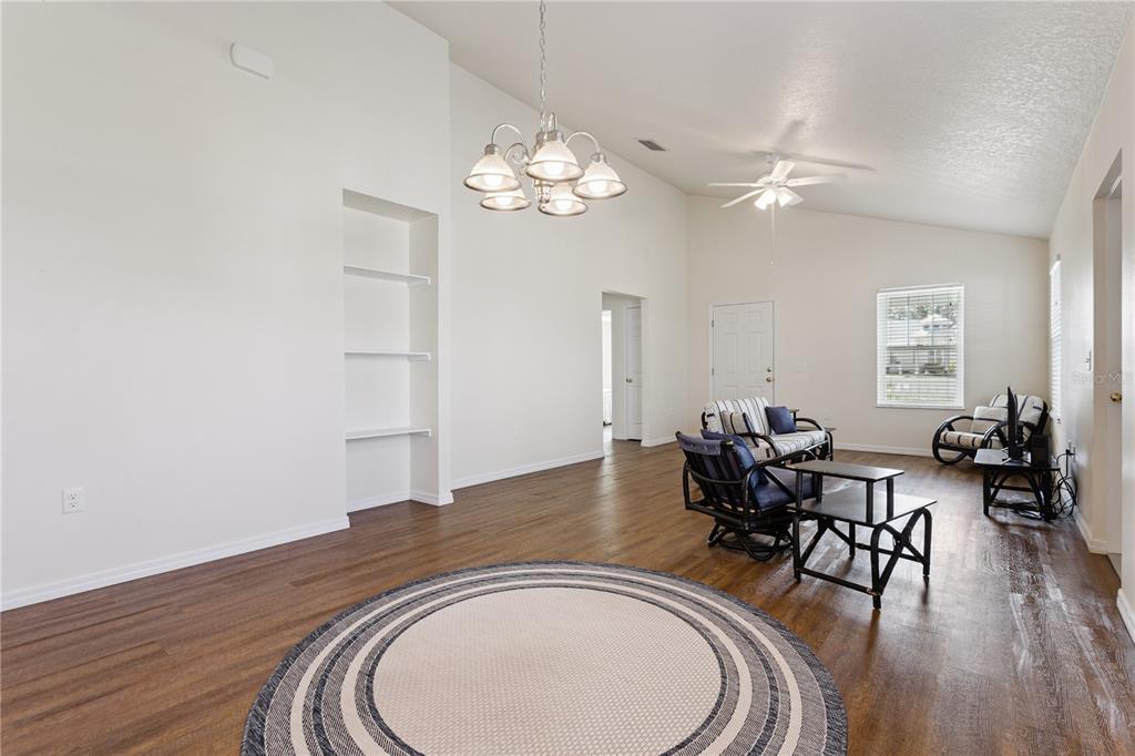 112 Turtle Run Umatilla, FL 32784 - Photo 8 of 32 a view of a dining room with furniture window and wooden floor