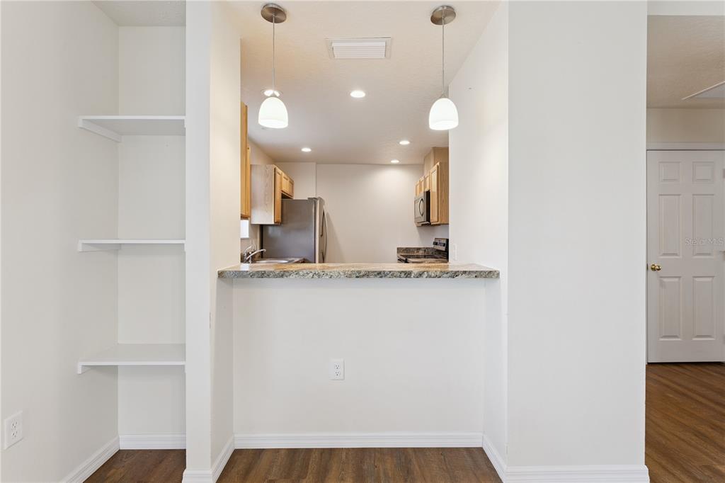 112 Turtle Run Umatilla, FL 32784 - Photo 10 of 32 a view of a kitchen with a sink and refrigerator