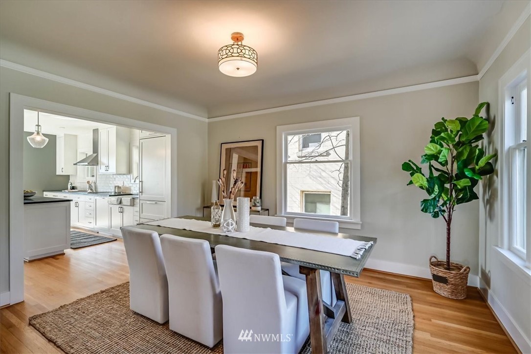 357 Highland Drive Seattle, WA 98109 - Photo 13 of 38 a living room with kitchen island furniture and a potted plant