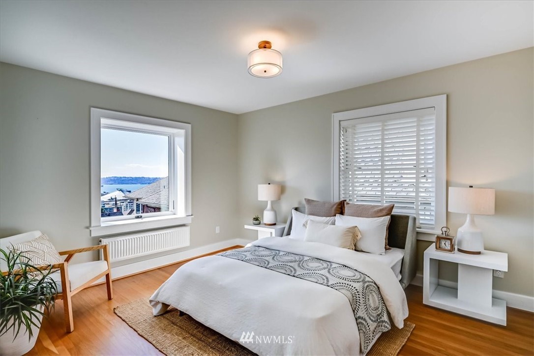 357 Highland Drive Seattle, WA 98109 - Photo 15 of 38 a bedroom with bed and a window