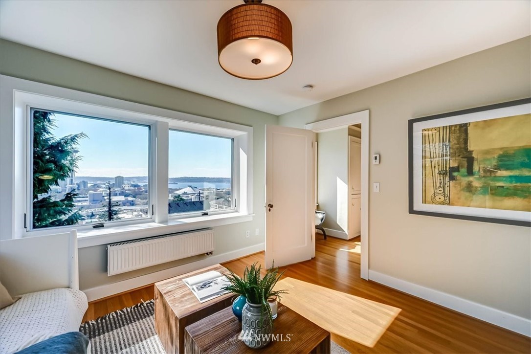 357 Highland Drive Seattle, WA 98109 - Photo 18 of 38 a living room with furniture and a large window